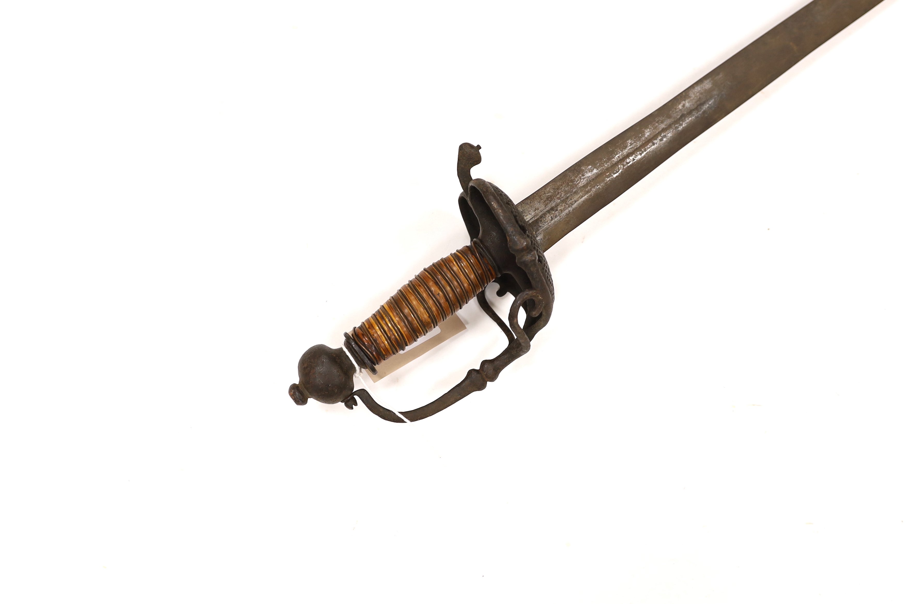 A 17th century Walloon-hilted small sword with pierced iron guard, replacement wooden grip and wide blade (possibly associated), blade 79cm